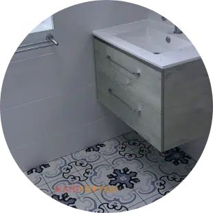 close up of brand new kitchen sink with custom tiled floor
