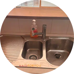 c;lose up of a double stainless steel sink after being cleaned