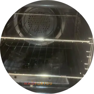 close up of a extremely soiled oven before being cleaned