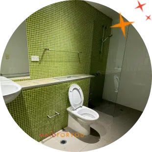 green tiled wall office toilet after being cleaned