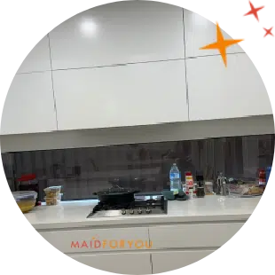all white kitchen with stainless steel 4 burner cooktop in the background