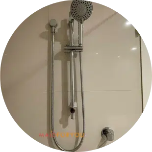 close up of stainless steel shower head after being cleaned