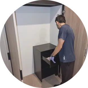 Maidforyou cleaner Jonathan cleaning the inside of a wardrobe
