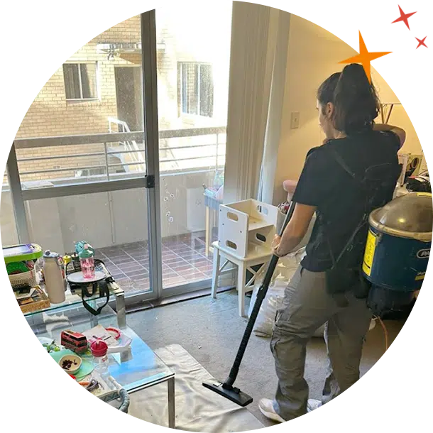 Maidforyou cleaner Hola vacuuming a living room