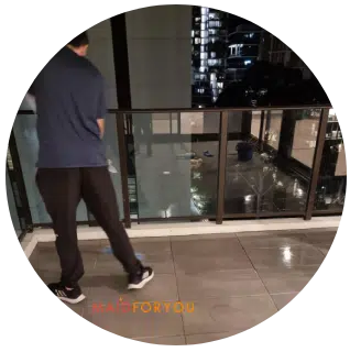 Jonathan mopping tiled balcony flooring